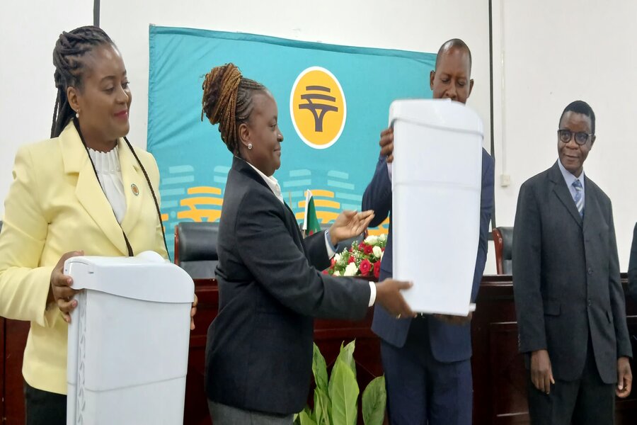 FNB representative handing over the sanitary bin to the minister. Picture by MGEE