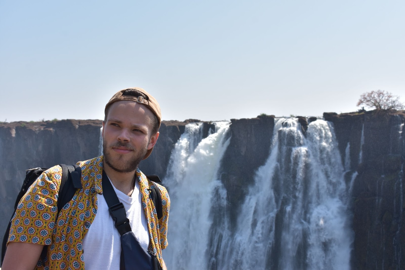 Student standing in front of the Victoria Falls