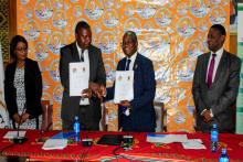 UNZA Vice Chancellor exchanging documents with Lusaka Water and Sewerage Company Managing Director